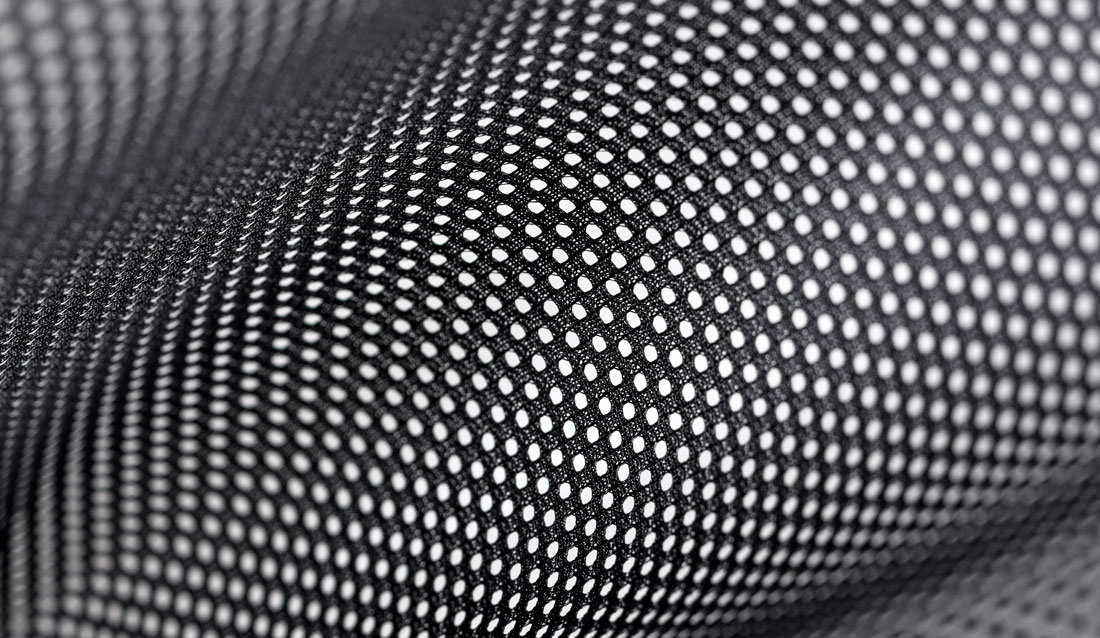 Breathable textile with a varied hole structure